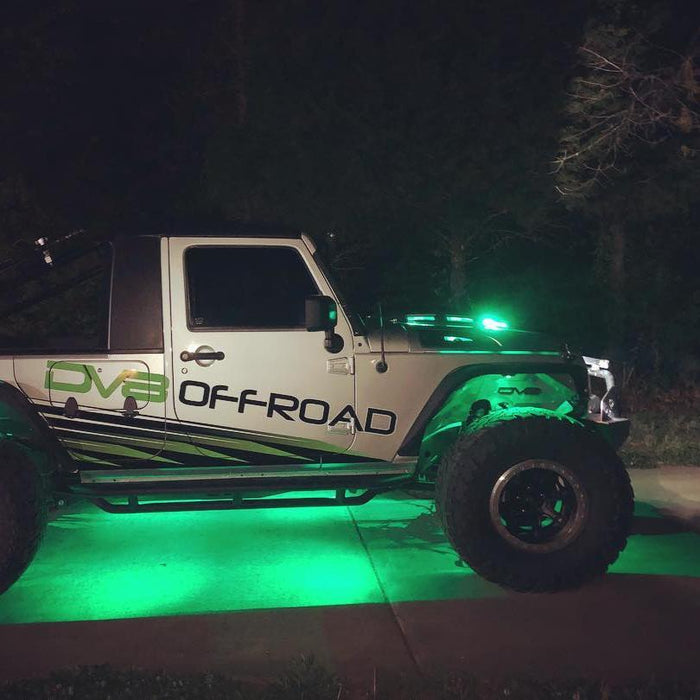 Side view of a Jeep with green LED rock lights.