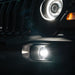 Extreme close-up on the grill of a Jeep, equipped with High Performance LED Fog Lights and Oculus Headlights.