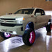 White truck in garage with multiple ORACLE Lighting products installed.