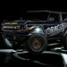 Three quarters view of wrapped Ford Bronco with white LED rock lights installed