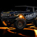 Three quarters view of wrapped Ford Bronco with amber LED rock lights installed