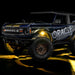 Three quarters view of wrapped Ford Bronco with yellow LED rock lights installed