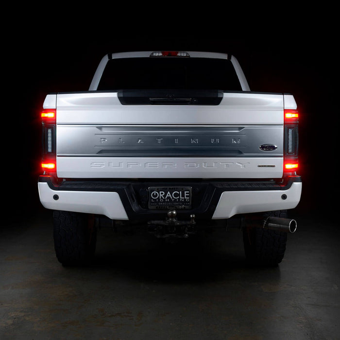 Straight rear view of a white Ford Superduty with Flush Mount Tail Lights installed and brake lights on.