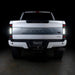 Straight rear view of a white Ford Superduty with Flush Mount Tail Lights installed and reverse lights on.