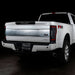 Rear three quarters view of a white Ford Superduty with Flush Mount Tail Lights installed.