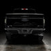 Straight rear view of black Ford F-150 with Tinted Flush Style LED Tail Lights installed