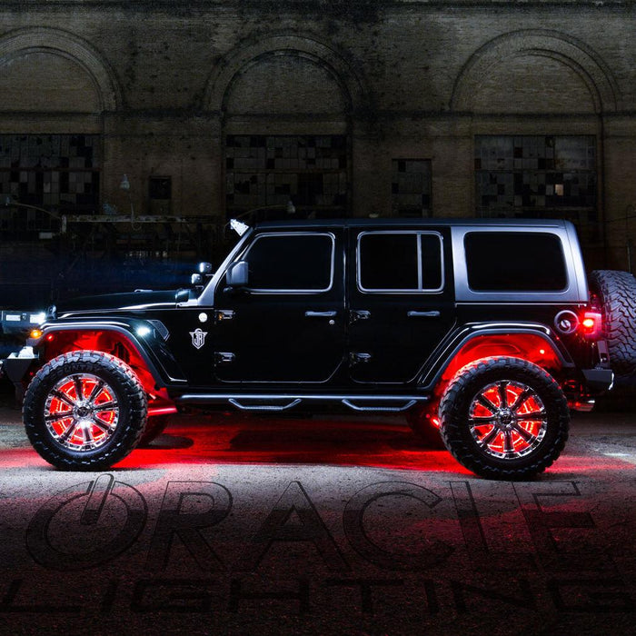 Side profile of a black Jeep with multiple ORACLE Lighting products installed, the focus being the red LED wheel rings.