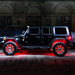 Side profile of a black Jeep with multiple ORACLE Lighting products installed, the focus being the red LED wheel rings.