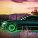 Side profile of a Ford Mustang with green LED wheel rings illuminating the road.