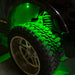 Close-up of wheel well with green rock light glowing.