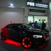 An Audi parked in a garage with red LED wheel rings installed.