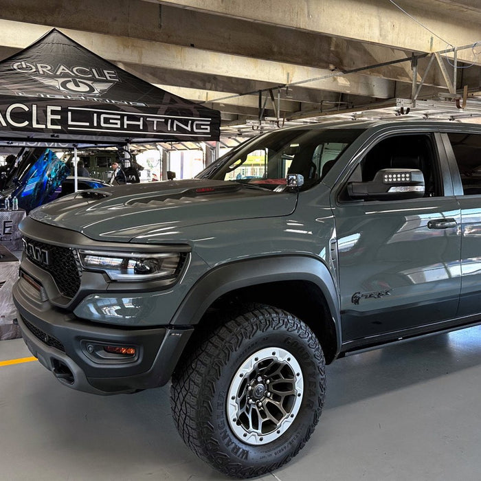 A grey RAM TRX with LED Off-Road Side Mirror Ditch Lights installed.