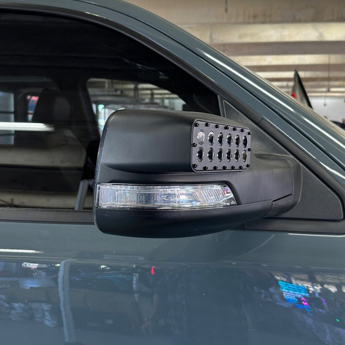 Side view of LED Off-Road Side Mirror Ditch Lights installed on a RAM TRX.