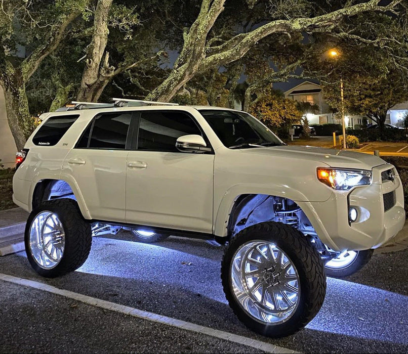 White toyota with white LED wheel rings.