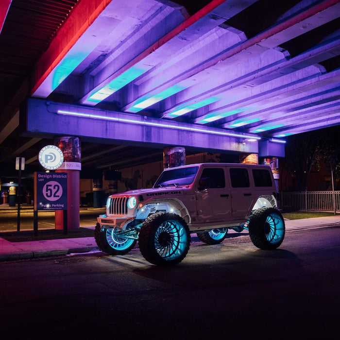 White jeep with aqua blue LED wheel rings.