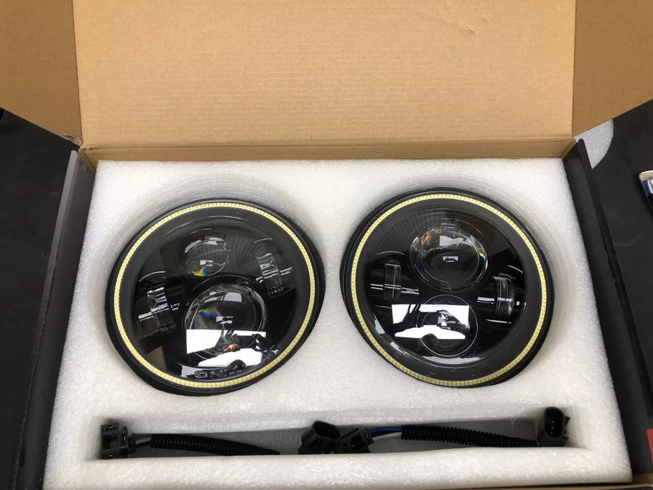 USED ORACLE 7" HIGH POWERED BLACK LED HEADLIGHTS WITH WHITE HALOS 5769-001