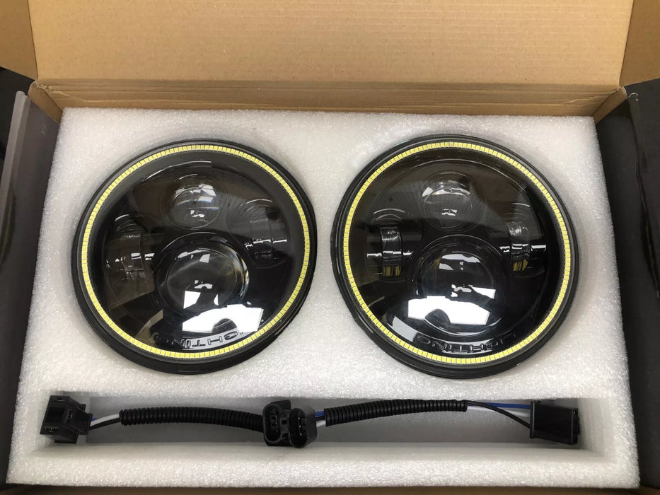 USED ORACLE 7" HIGH POWERED BLACK LED HEADLIGHTS WITH WHITE LED HALOS 5769-001