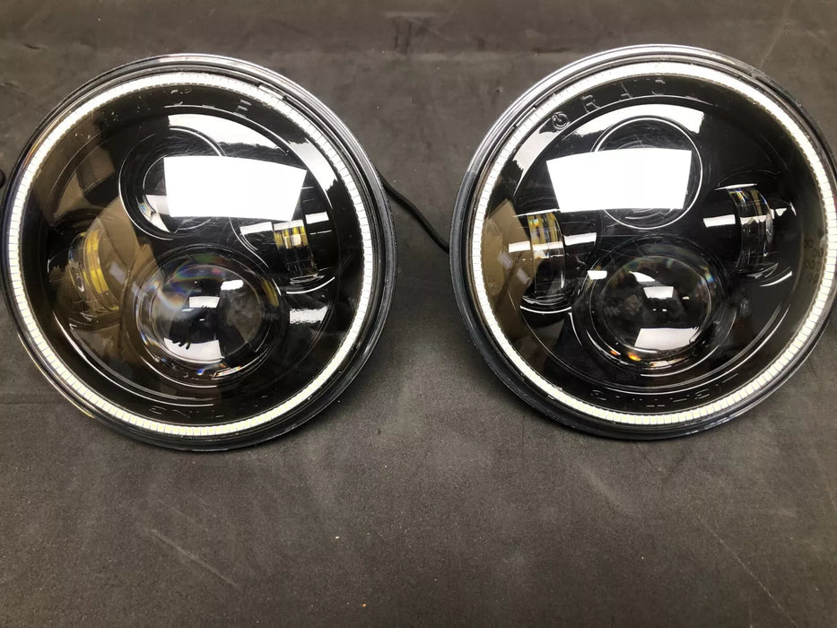 USED ORACLE 7" HIGH POWERED BLACK LED HEADLIGHTS WITH WHITE HALOS 5769-001