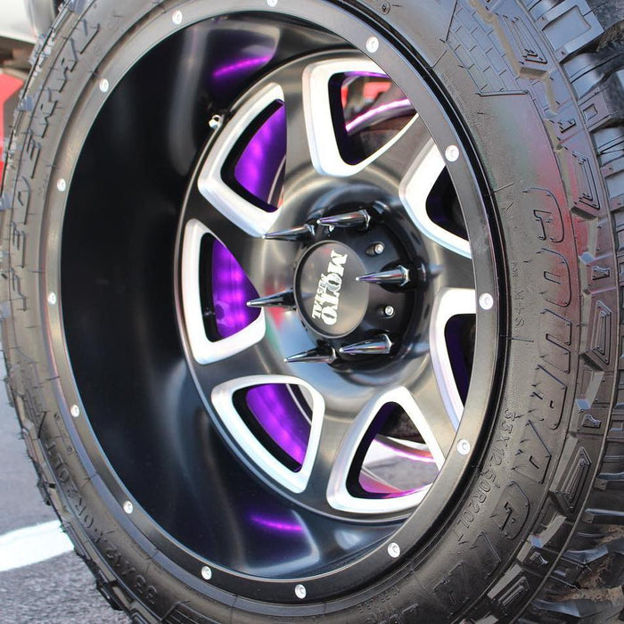 Extreme close-up of a wheel with LED illuminated wheel rings installed.