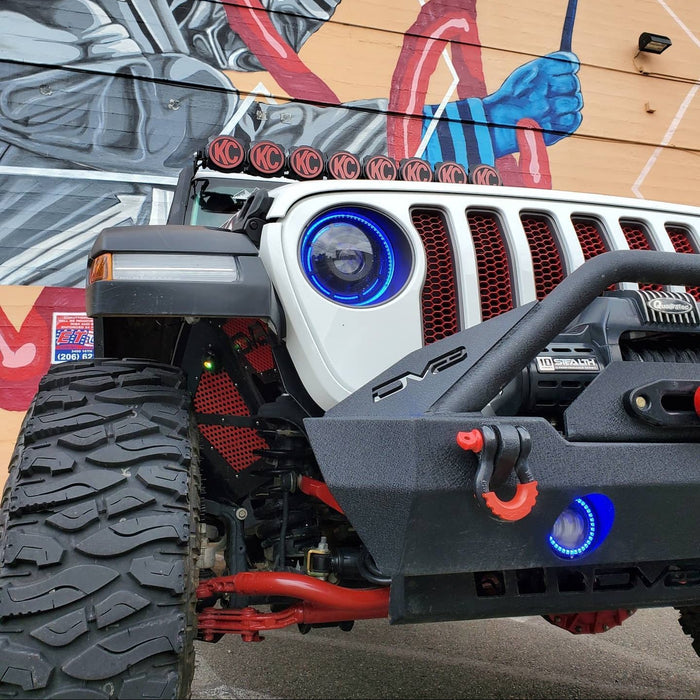 Front end of a Jeep with ColorSHIFT Oculus Headlights installed, and blue halo rings.