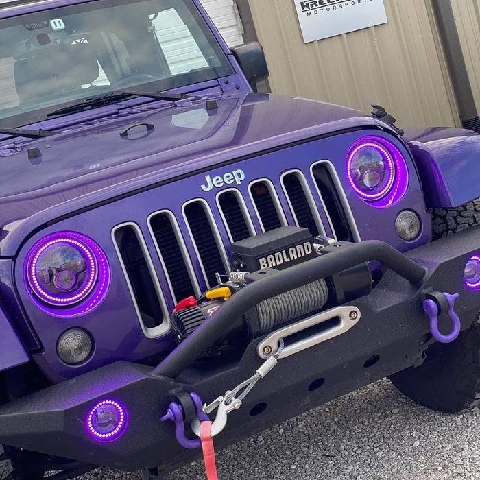 Front end of a Jeep Wrangler with 7" High Powered LED Headlights installed.