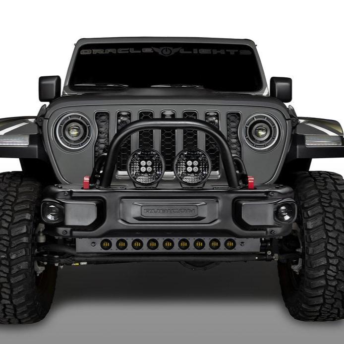 Front end of a Jeep with multiple ORACLE Lighting products installed, including LED Integrated Skid Plate, Oculus Headlights, and 9" Spotlights.