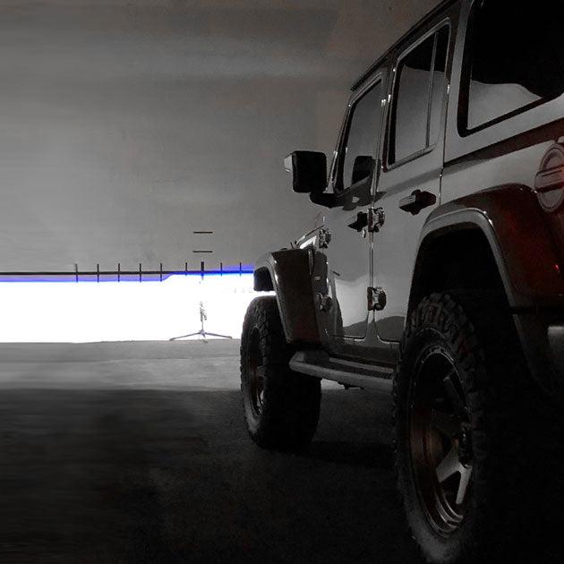 Rear view of a Jeep Wrangler, showing the sharp cutoff line of the Oculus Headlights.