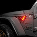 Close-up of Sidetrack™ LED Lighting System installed on a Jeep, and set to amber LED mode.