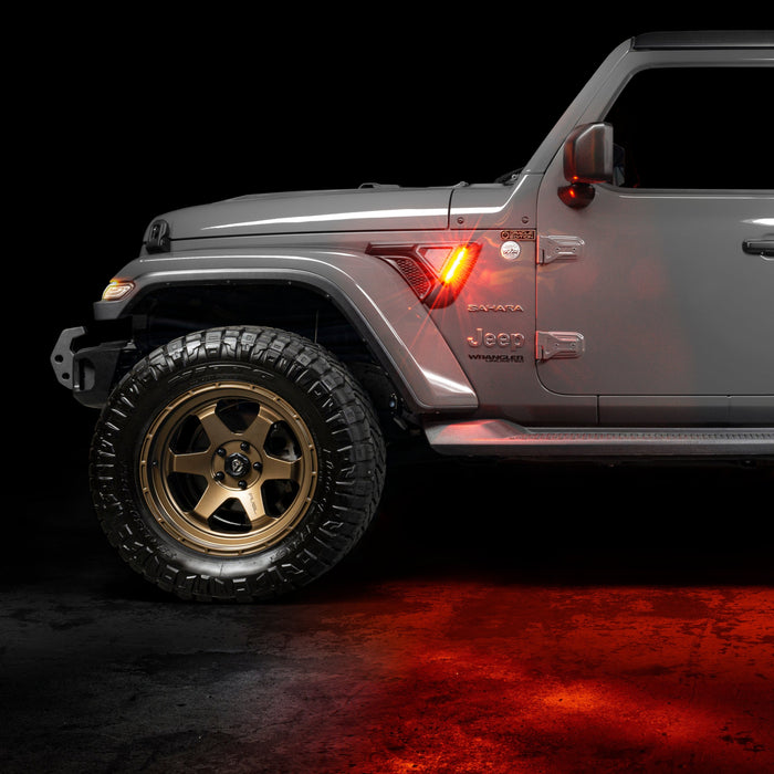 Side view of a Jeep with Sidetrack™ LED Lighting System installed, and set to amber LED mode.