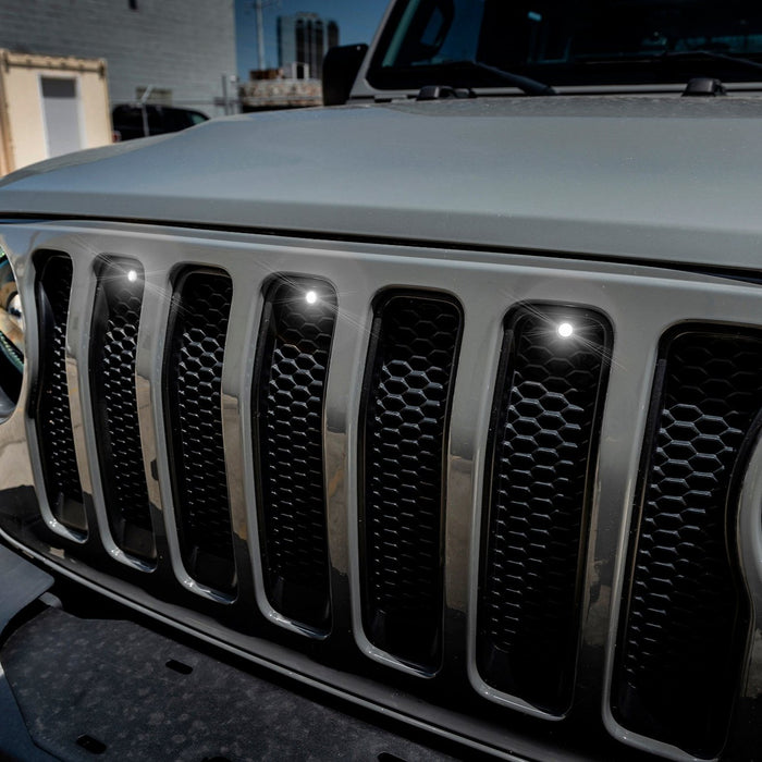 Close-up on the front end of a Jeep Wrangler with Universal Pre-Runner Style LED Grill Light Kit