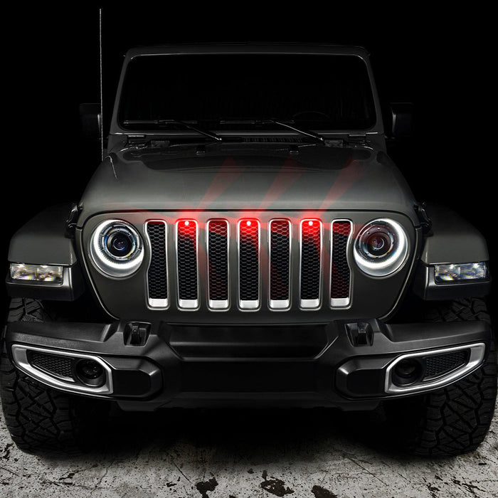 Front end of a Jeep Wrangler with red LED Grill Light Kit installed.