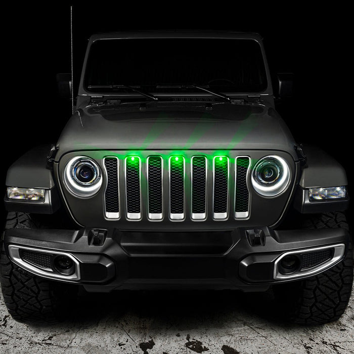 Front end of a Jeep Wrangler with green LED Grill Light Kit installed.