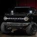 Studio shot of a black Ford Bronco equipped with the Integrated Windshield Roof LED Light Bar System.