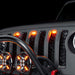 Close-up of Universal Pre-Runner Style LED Grill Light Kit installed on a Jeep Wrangler with amber LEDs.