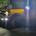 Yellow Ford Bronco in a driveway with LED Off-Road Side Mirrors turned on.