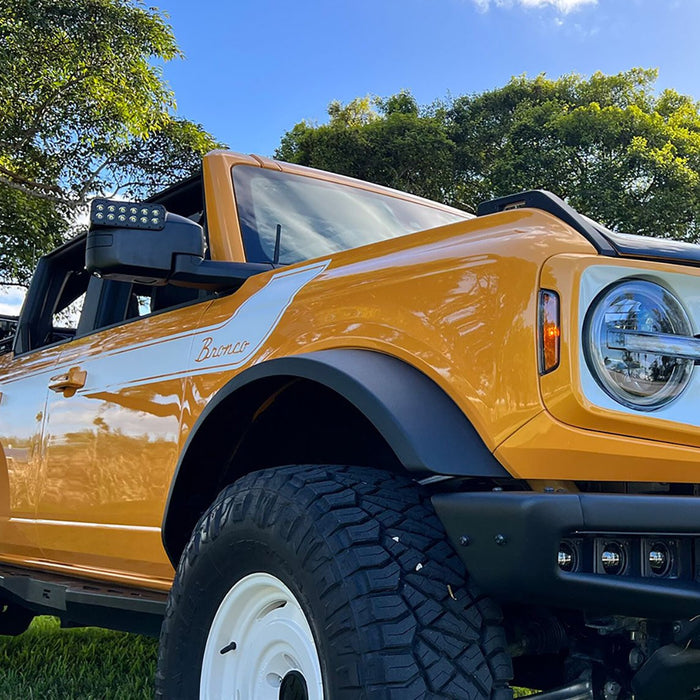 Low angle of an orange Ford Bronco with LED Off-Road Side Mirrors installed.