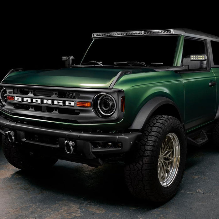 Three quarters view of a green Ford Bronco with LED Off-Road Side Mirrors.