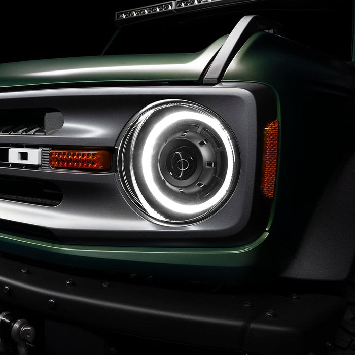 Close-up of a Ford Bronco grill with Oculus Headlights installed, and white DRLs turned on.