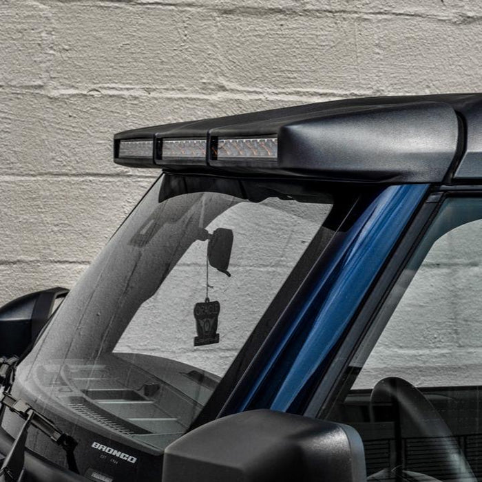 Side view of the Integrated Windshield Roof LED Light Bar System installed on a blue Ford Bronco.