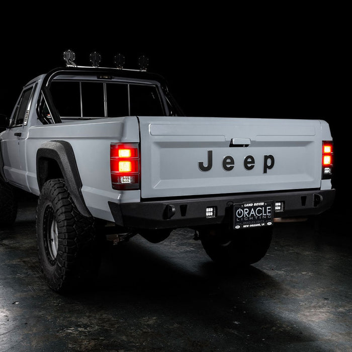 3 quarters rear view of Jeep Comanche with flush mount tail lights and brake lights on