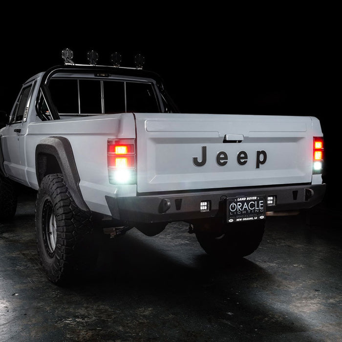 3 quarters rear view of Jeep Comanche with flush mount tail lights and reverse lights on