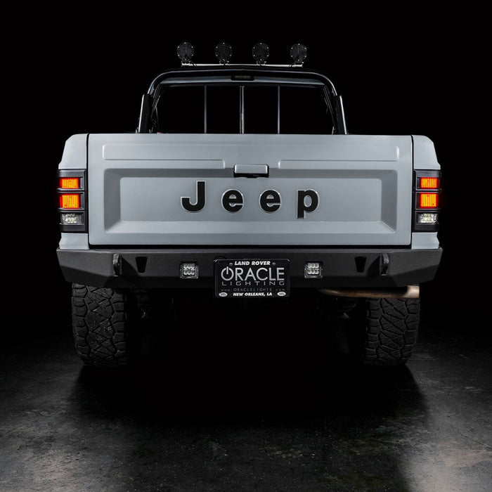 Rear view of Jeep Comanche with flush mount tail lights and DRL on