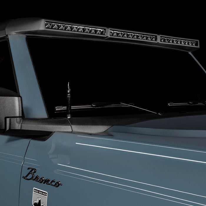 Close-up of a grey Ford Bronco with the Integrated Windshield Roof LED Light Bar System installed.