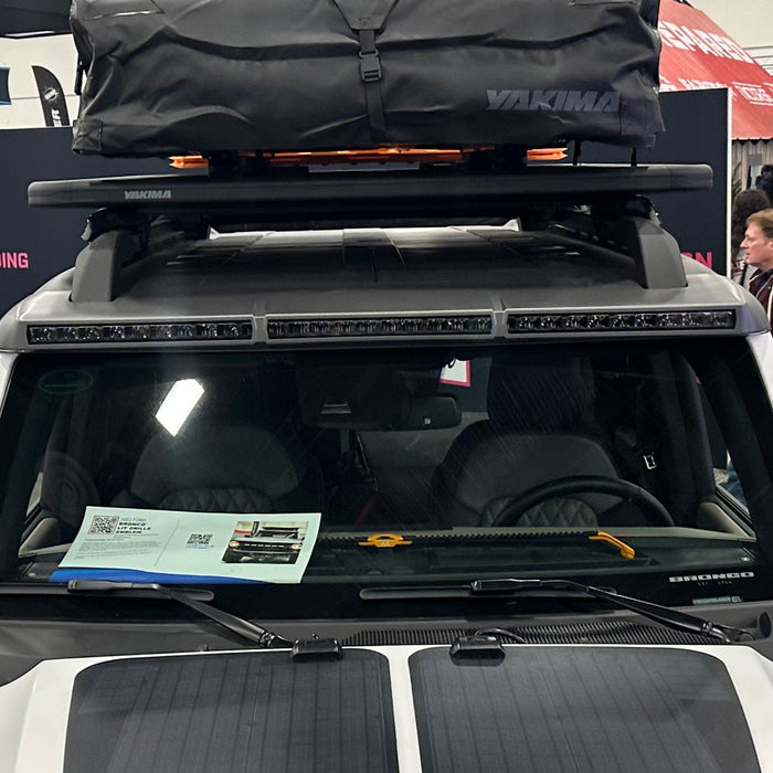 Close-up of a Integrated Windshield Roof LED Light Bar System installed on a white Ford Bronco.