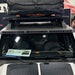 Close-up of a Integrated Windshield Roof LED Light Bar System installed on a white Ford Bronco.