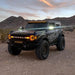 ORACLE Lighting Bronco parked in the desert with LED Off-Road Side Mirrors glowing.