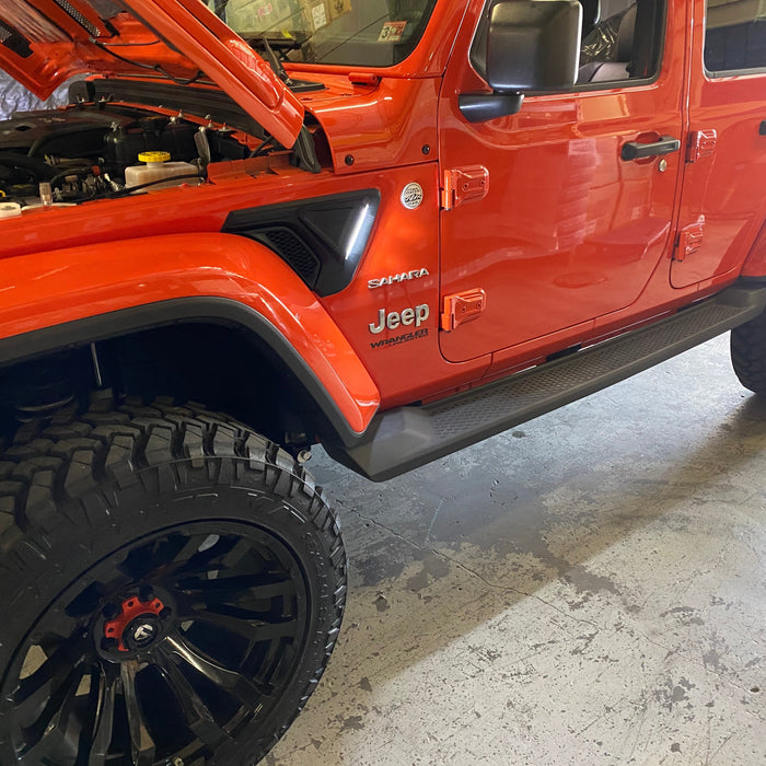 Close-up of Sidetrack™ LED Lighting System installed on a Jeep, with white LEDs on.