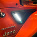 Close-up of Sidetrack™ LED Lighting System installed on a Jeep, with white LEDs on.