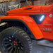 Close-up of Sidetrack™ LED Lighting System installed on a Jeep, with white LEDs on.