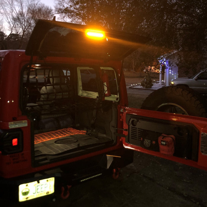 Red jeep with amber LED cargo light